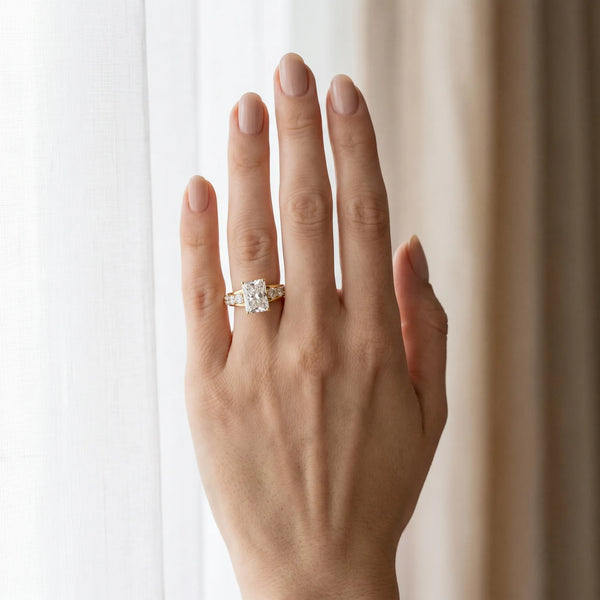 Yellow gold Radiant Cut Diamond Engagement Ring with Pavé Band and Four-Prong Setting