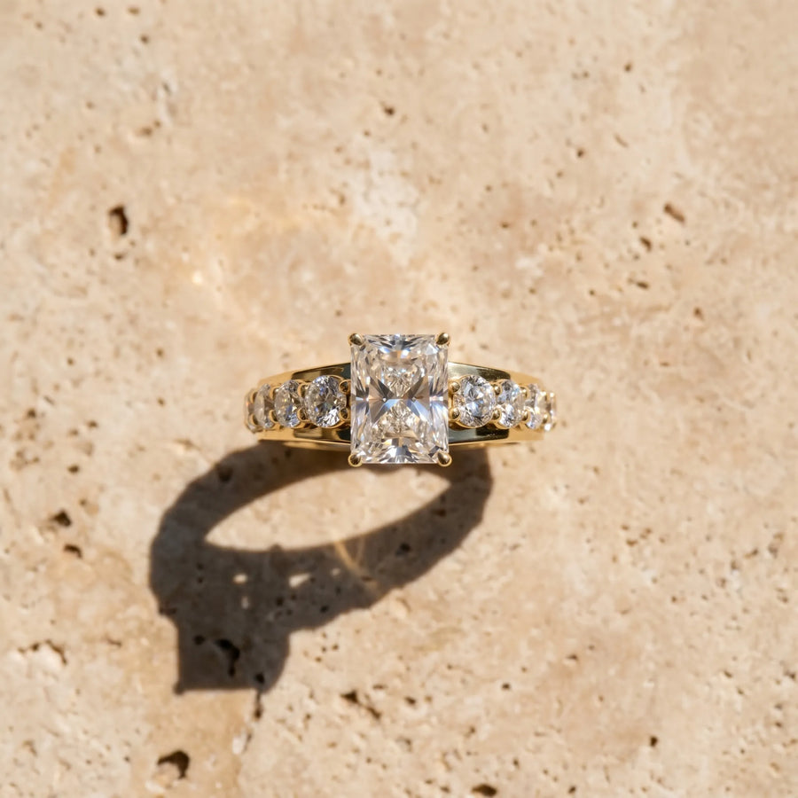 Yellow gold Radiant Cut Diamond Engagement Ring with Pavé Band and Four-Prong Setting