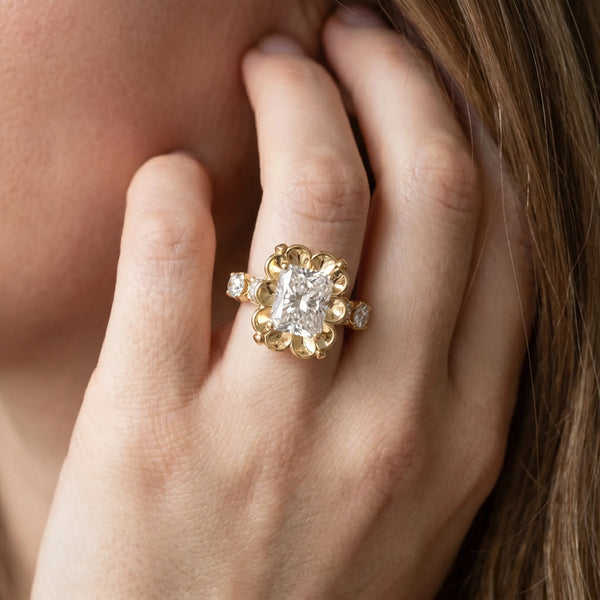 Yellow gold Radiant Cut Diamond Floral Halo Engagement Ring with Shared Prong Setting