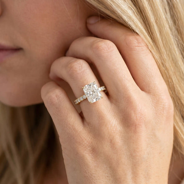 Yellow gold Radiant Cut Diamond Pavé Band Solitaire Ring with Prong Setting