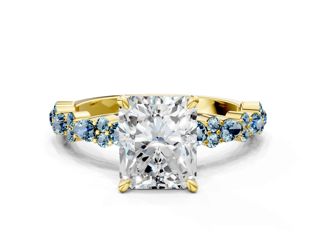 Yellow gold Radiant Cut Diamond Side Stone Solitaire Ring with Round with Aquamarine side stone and Four-Prong Setting