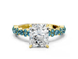 Yellow gold Radiant Cut Diamond Side Stone Solitaire Ring with Round with Blue Topaz side stone and Four-Prong Setting