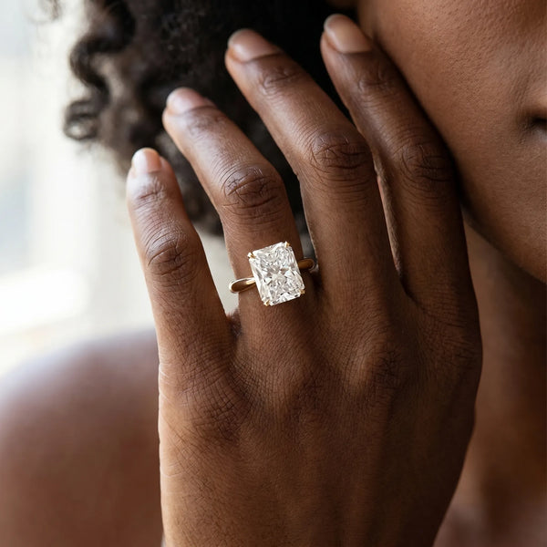 Yellow gold Radiant Cut Diamond Solitaire Engagement Ring with Cathedral Setting and Four-Prong Mount