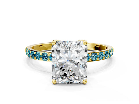 Yellow gold Radiant Cut Diamond Solitaire Engagement Ring with Round with Blue Topaz side stone Pavé Band and Prong Setting