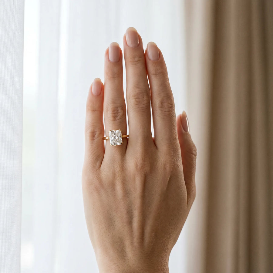 Yellow gold Radiant Cut Diamond Solitaire Ring with Flower Prong Setting and Classic Band