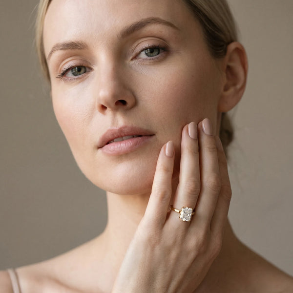 Yellow gold Radiant Cut Diamond Solitaire Ring with Flower Prong Setting and Classic Band