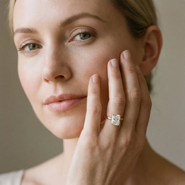 Yellow gold Radiant Cut Diamond Solitaire Ring with Six-Prong Setting and Classic Band