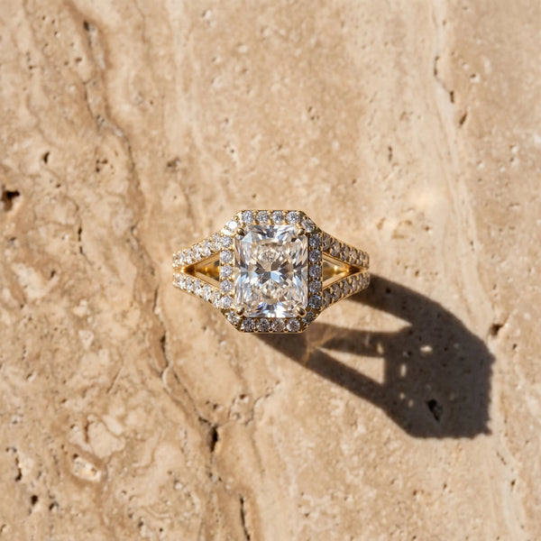 Yellow gold Radiant Cut Diamond Split Shank Halo Ring with Four-Prong Setting