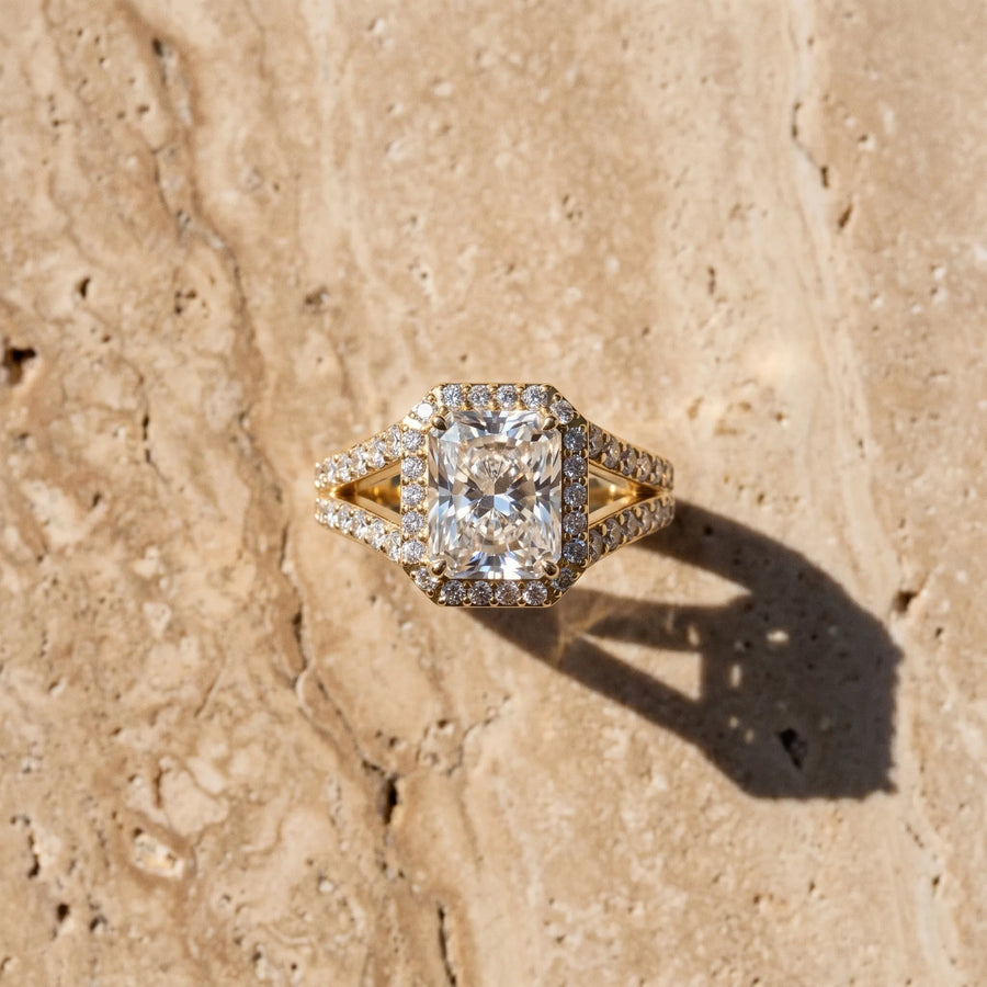 Yellow gold Radiant Cut Diamond Split Shank Halo Ring with Four-Prong Setting