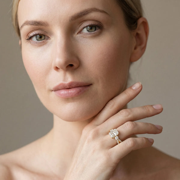 Yellow gold Radiant Cut Diamond Three-Stone Ring with Pavé Split Shank and Four-Prong Setting