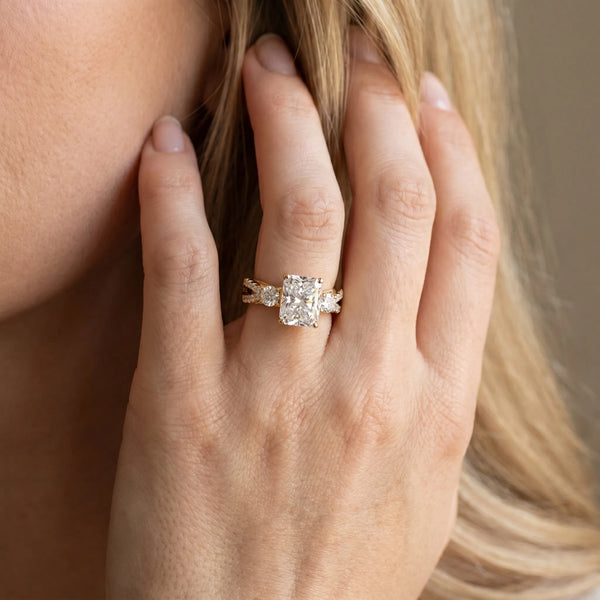Yellow gold Radiant Cut Diamond Three-Stone Ring with Pavé Split Shank and Four-Prong Setting