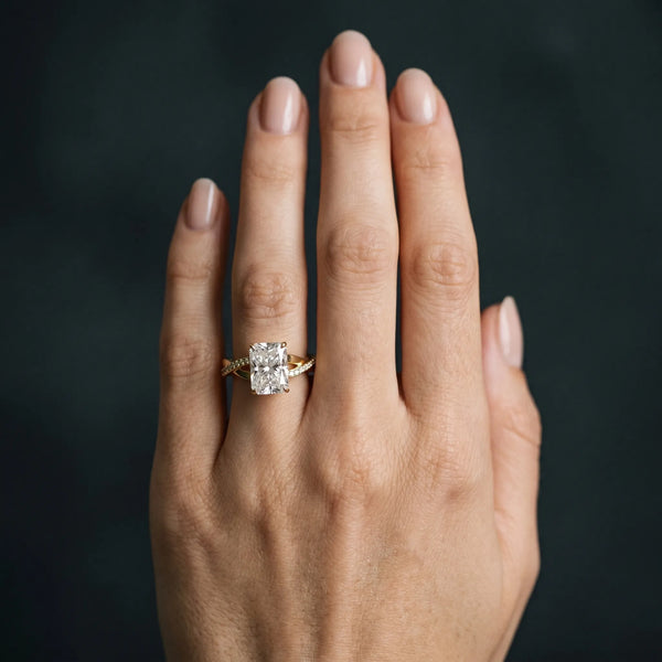Yellow gold Radiant Cut Diamond Twisted Band Engagement Ring with Prong Setting