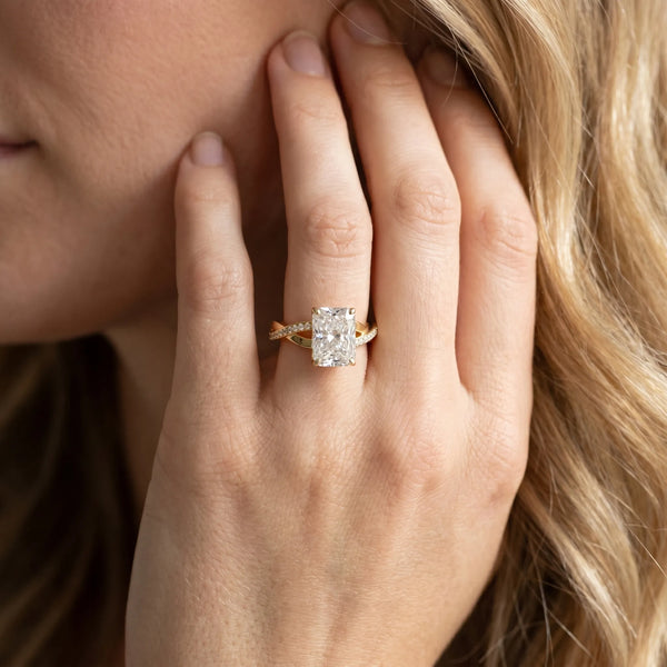 Yellow gold Radiant Cut Diamond Twisted Band Engagement Ring with Prong Setting