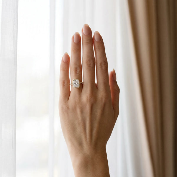 Yellow gold Radiant Cut Halo Diamond Engagement Ring with Pave Band and Four-Prong Setting