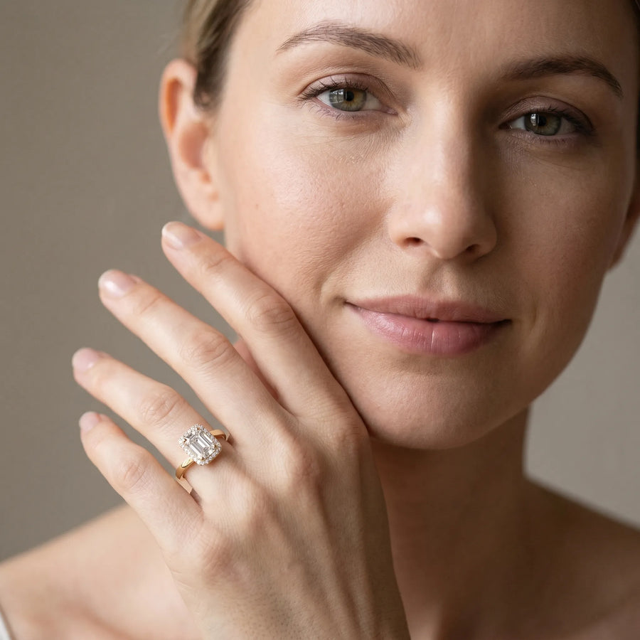 Yellow gold Radiant Cut Halo Solitaire Ring with Channel Band and Four-Prong Setting