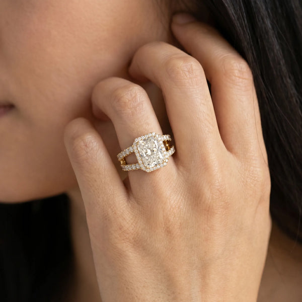 Yellow gold Radiant Cut Halo Split Shank Diamond Ring with Four-Prong Setting