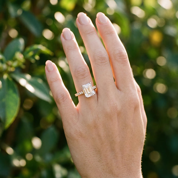 Yellow gold Radiant Cut Solitaire Diamond Ring with Pave Band and Four-Prong Setting
