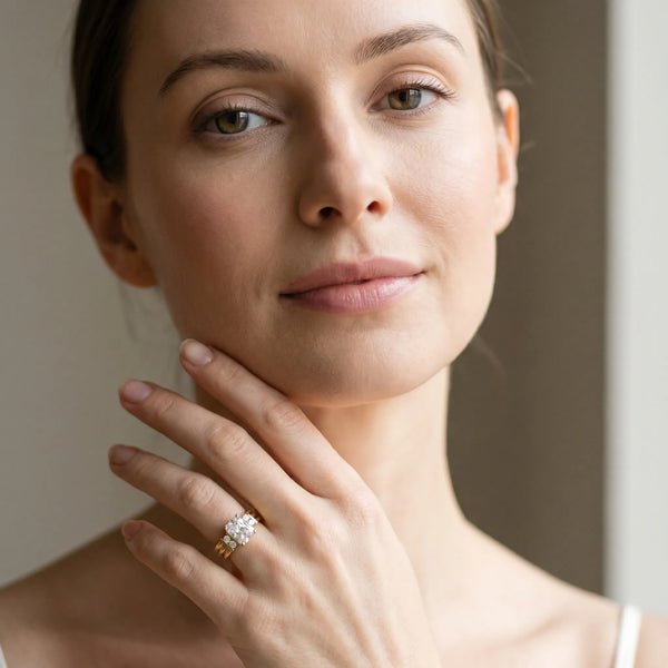 Yellow gold Radiant Cut Three-Stone Channel Set Ring with Bar Prongs