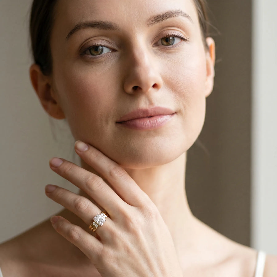 Yellow gold Radiant Cut Three-Stone Channel Set Ring with Bar Prongs