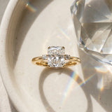 Yellow gold Radiant Cut Three-Stone Solitaire Ring with Round Accent Diamonds and Four-Prong Setting_15