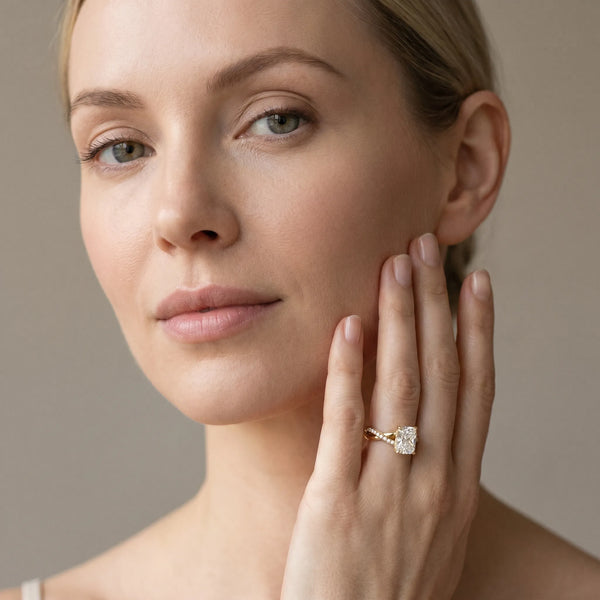 Yellow gold Radiant Cut Twist Band Solitaire Diamond Ring with Pavé Setting