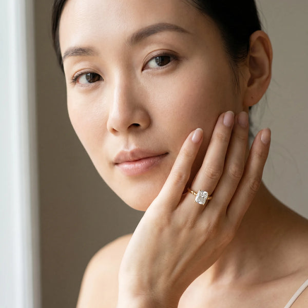 Yellow gold Radiant Solitaire Beaded Band with Four-Prong Setting