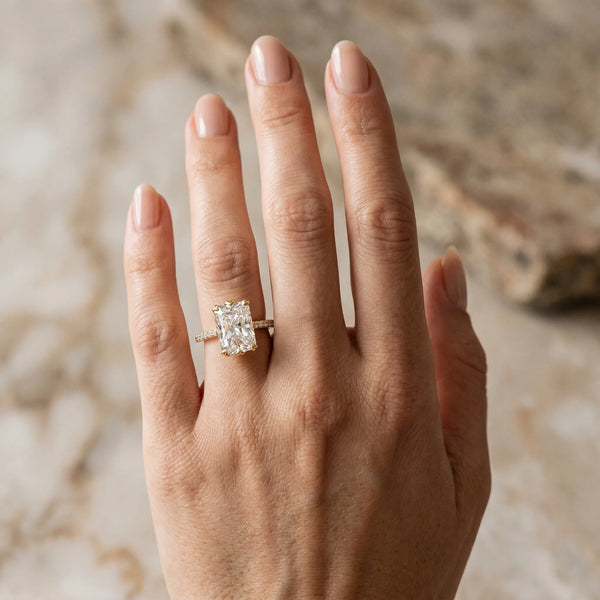 Yellow gold Radiant Solitaire Diamond Engagement Ring with Pave Band and Six-Prong Setting