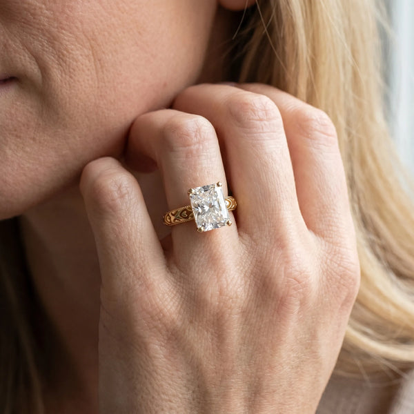 Yellow gold Radiant Solitaire Diamond Engagement Ring with XO Engraved Band and Four-Prong Setting