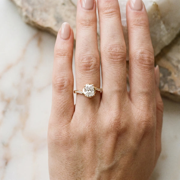 Yellow gold Radiant Solitaire Twist Band with Channel-Set Diamonds and Four-Prong Setting