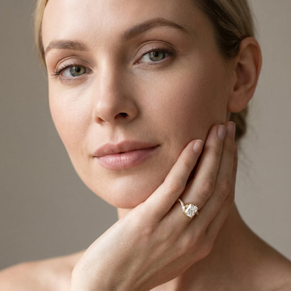Yellow gold Radiant Solitaire Twist Band with Channel-Set Diamonds and Four-Prong Setting
