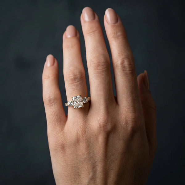 Yellow gold Radiant Three-Stone Diamond Ring with Pavé Band and Four-Prong Setting