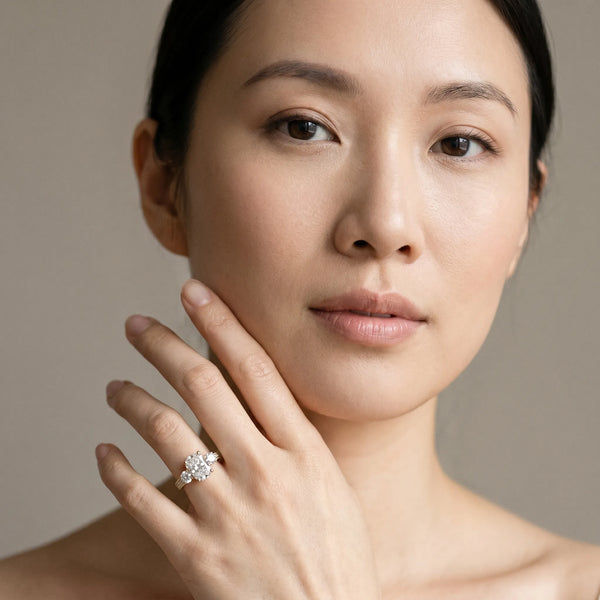 Yellow gold Radiant Three-Stone Diamond Ring with Pavé Band and Four-Prong Setting