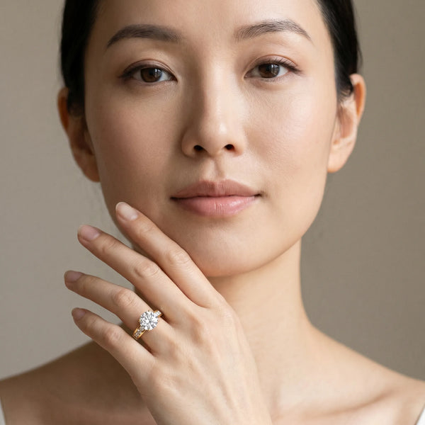 Yellow gold Round Brilliant Channel-Set Solitaire Ring with Four-Prong Setting