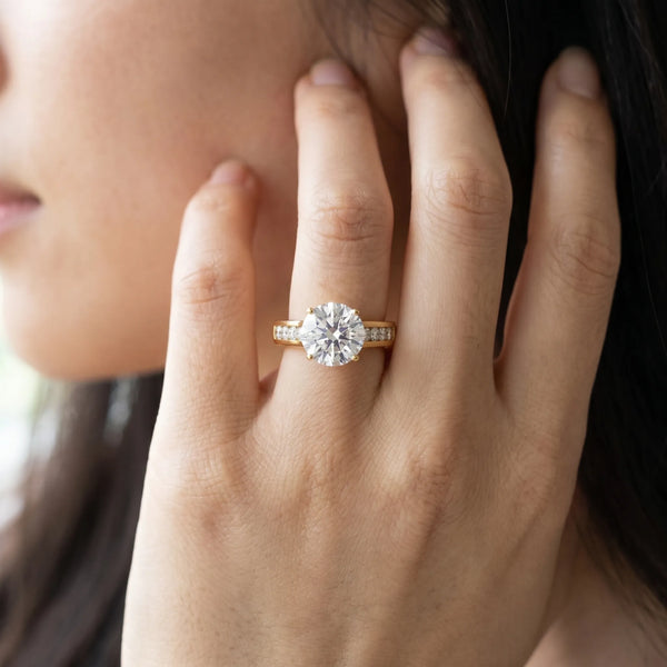 Yellow gold Round Brilliant Channel-Set Solitaire Ring with Four-Prong Setting