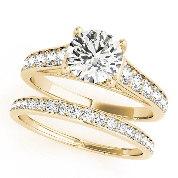 Yellow gold Round Brilliant Cut Diamond Engagement Ring with Pavé Band and Four-Prong Setting