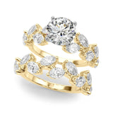 Yellow gold Round Brilliant Diamond Solitaire with Marquise and Pear Accent Stones on a Split Shank Band with Four-Prong Setting 1