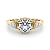 Yellow gold Round Brilliant Diamond Solitaire with Side Stones on a Tapered Band and Four-Prong Setting 1