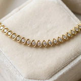 Yellow gold Round Brilliant Diamond Tennis Bracelet with Channel Set S-Shaped Prong Setting_9