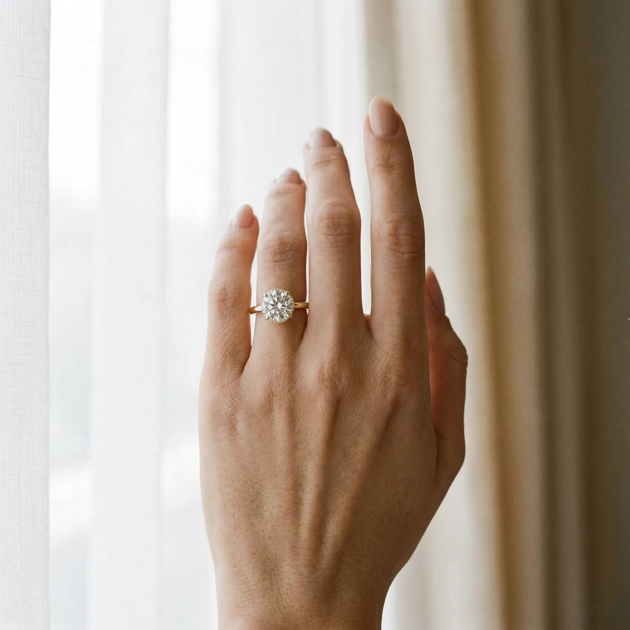 Yellow gold Round Brilliant Solitaire Engagement Ring with Six-Prong Setting and Classic Band