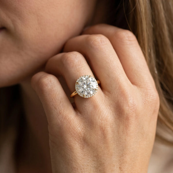 Yellow gold Round Brilliant Solitaire Engagement Ring with Six-Prong Setting and Classic Band