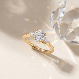 Yellow gold Round Brilliant Three-Stone Ring with Pear Side Stones and Four-Prong Setting_9