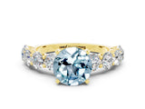 Yellow gold Round Cut Aquamarine Prong Setting with Side Stones on a Pave Band