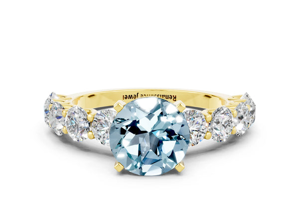 Yellow gold Round Cut Aquamarine Prong Setting with Side Stones on a Pave Band