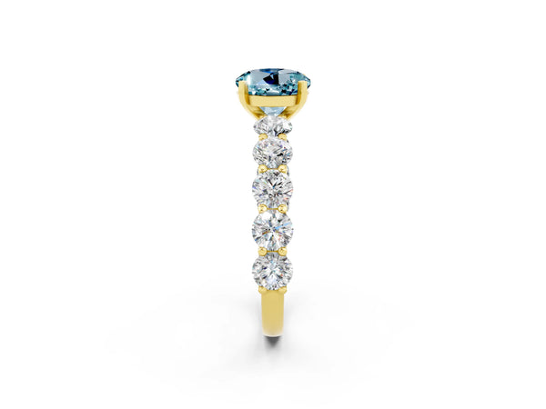 Yellow gold Round Cut Aquamarine Prong Setting with Side Stones on a Pave Band
