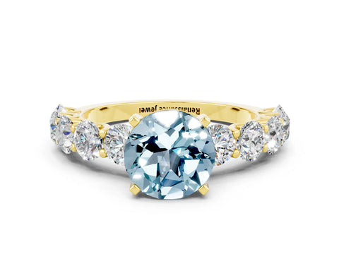 Yellow gold Round Cut Aquamarine Prong Setting with Side Stones on a Pave Band