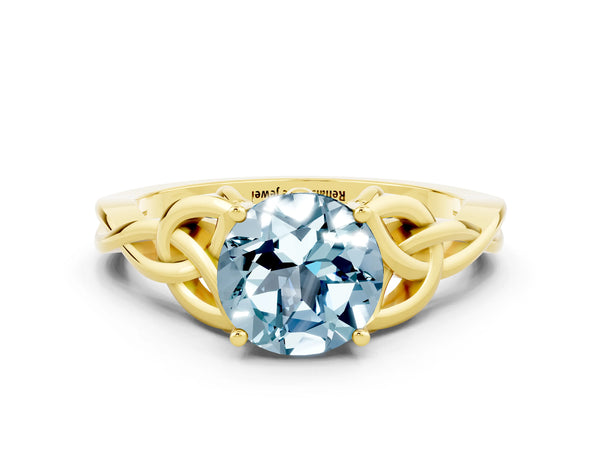 Yellow gold Round Cut Aquamarine Solitaire Celtic Knot Ring with Four-Prong Setting
