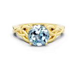 Yellow gold Round Cut Aquamarine Solitaire Engagement Ring with Celtic Knot Band and Four-Prong Setting