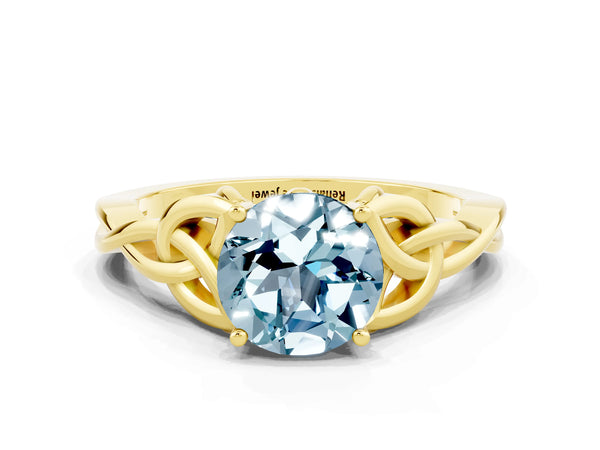 Yellow gold Round Cut Aquamarine Solitaire Engagement Ring with Celtic Knot Band and Four-Prong Setting