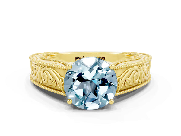 Yellow gold Round Cut Aquamarine Solitaire Ring with Engraved Band and Four-Prong Setting