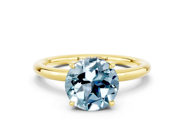 Yellow gold Round Cut Aquamarine Solitaire Ring with Thin Band and Four-Prong Setting